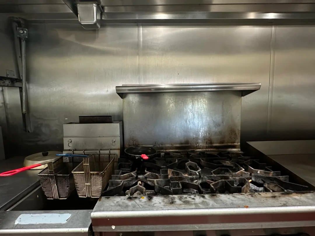 Commercial range and fryers in the on-site kitchen